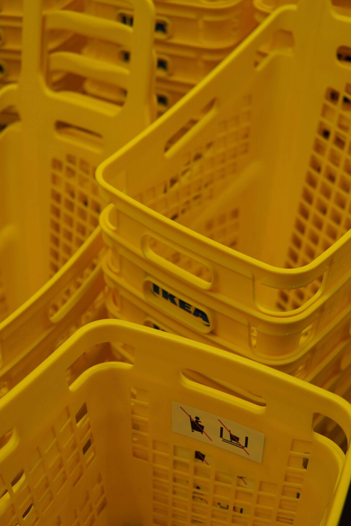 Yellow shopping baskets pile